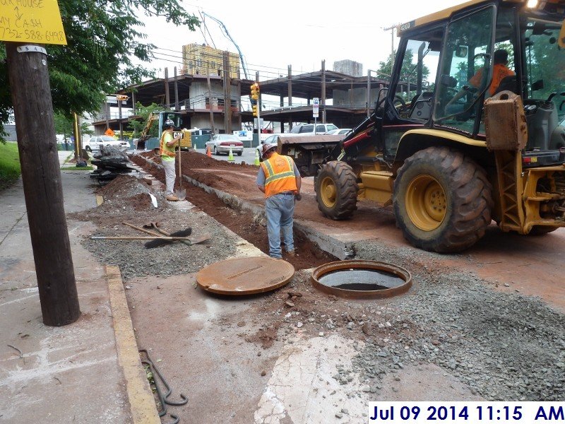 Installing a manhole at Rahway Ave. Facing the new Court Building (800x600)
